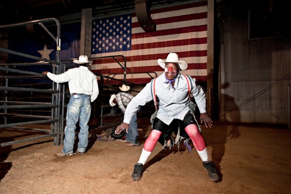 Marvin Hayes working as a bullfighter, making sure that none of the contestant come to any harm whilst bull riding.  Marvin was photographed at Cowboys of colour rodeo in Mesquite, Texas.