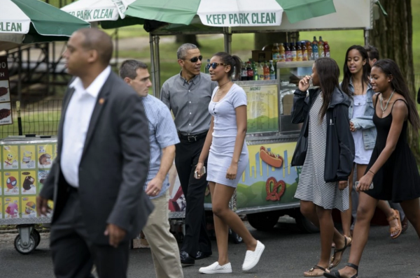 President Obama walks with daughters Sasha, center, and Malia and others in Central Park. (BRENDAN SMIALOWSKI/AFP/Getty Images)