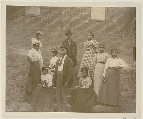 African American men and women posed for portrait on steps