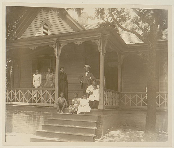Home of an African American lawyer, Atlanta, Georgia, with men, women, and children posed on porch of house