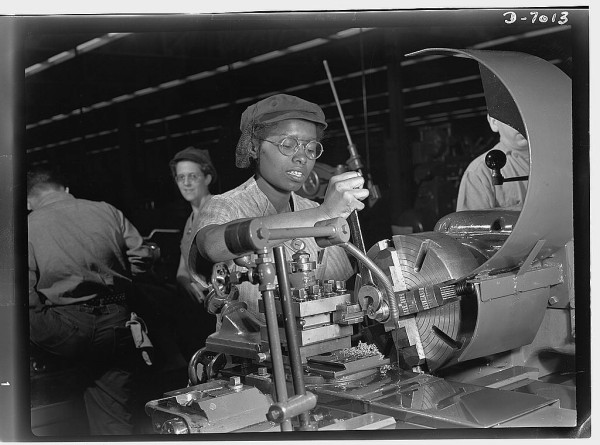 Plant foremen point to 20-year-old Annie Tabor as one of their best lathe operators, despite her lack of previous industrial experience. Employed by a large Midwest supercharger plant, this young woman machines parts of aircraft engines. Source
