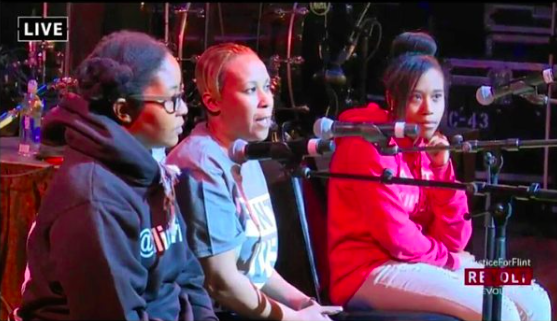 Nakia Wakes (middle) and her daughter (right) at #JusticeForFlint.